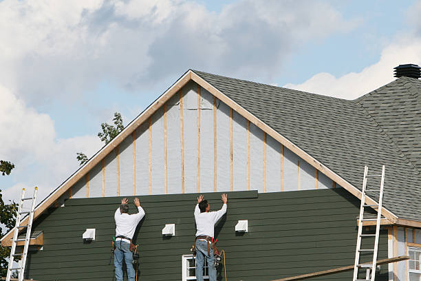 Professional Storm Damage Siding Repair technician working in Champlin, MN